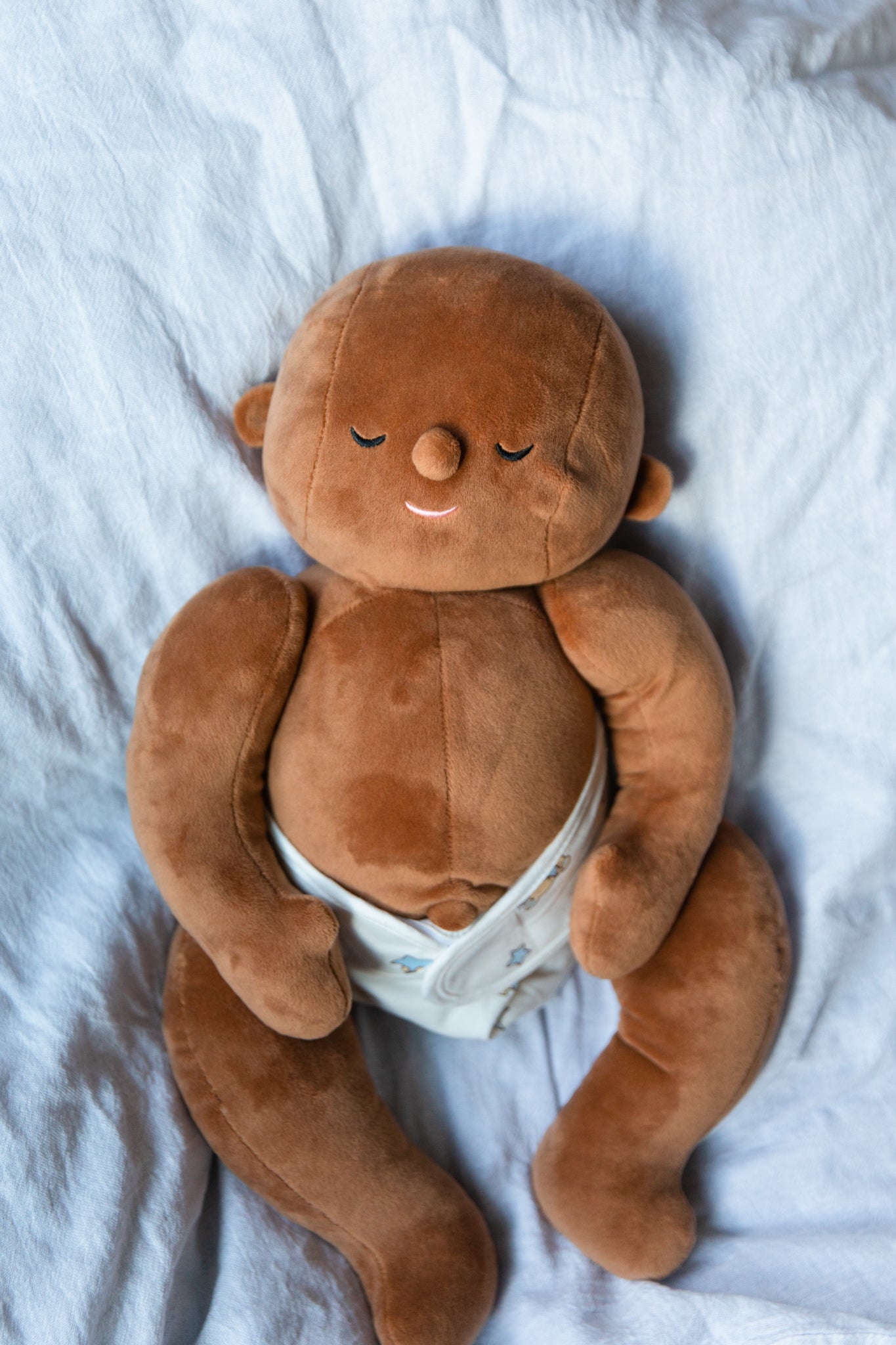 brown toned weighted doll