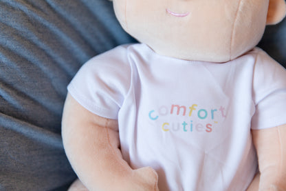 weighted cloth baby doll with comfort cuties branded onesie